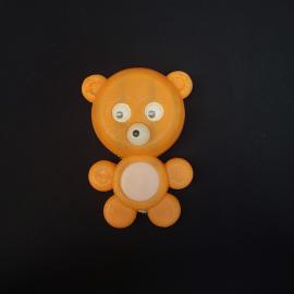 Игрушка пластмассовая винтажная, СССР. Медвежонок с подвижными глазами, оранжевая фигурка