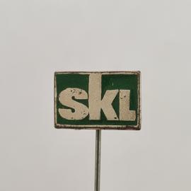 Значок СССР. Надпись SKL, зеленый фон, промышленная тематика. Винтажный значек.