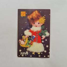 Карманный календарик 1989. Девочка с игрушками на фоне снежинок. Календарь винтажный