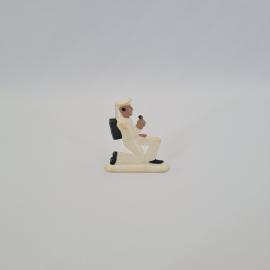 Фигурка винтажная, СССР. Игрушечный санитар в белой форме с сумкой на колене
